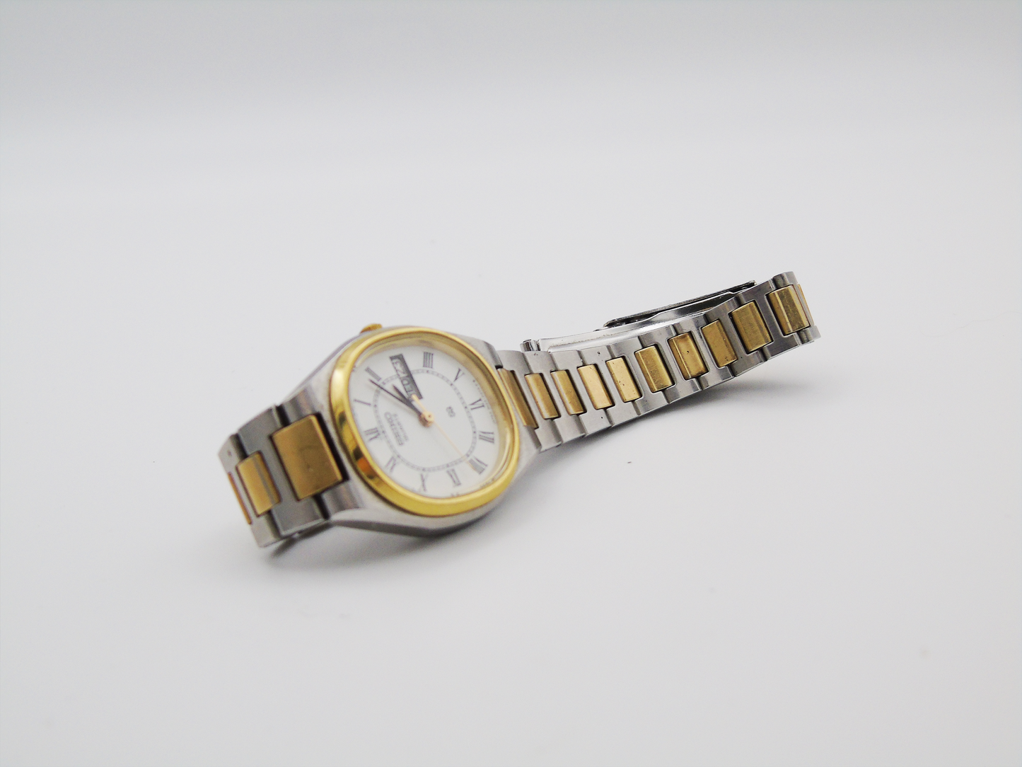 Seiko Ladies Watch Two tone Gold and Silver Tone Quartz Japanese Wristwatch Day Date Function - Gems Forgotten