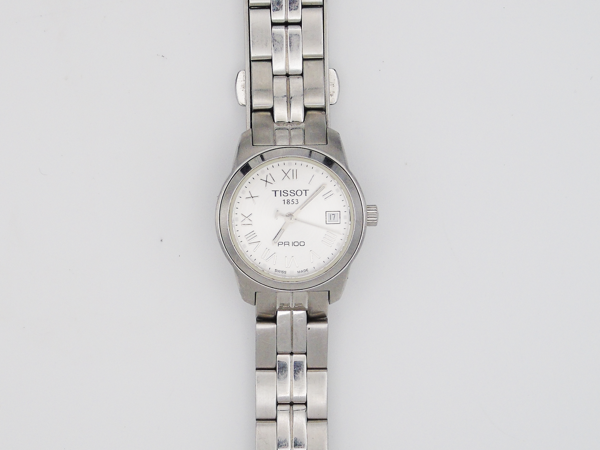 Tissot PR10 Ladies Watch Date FeatureSilver Tone Swiss Quartz Watch Small Wrist Elegant Steel - Gems Forgotten 