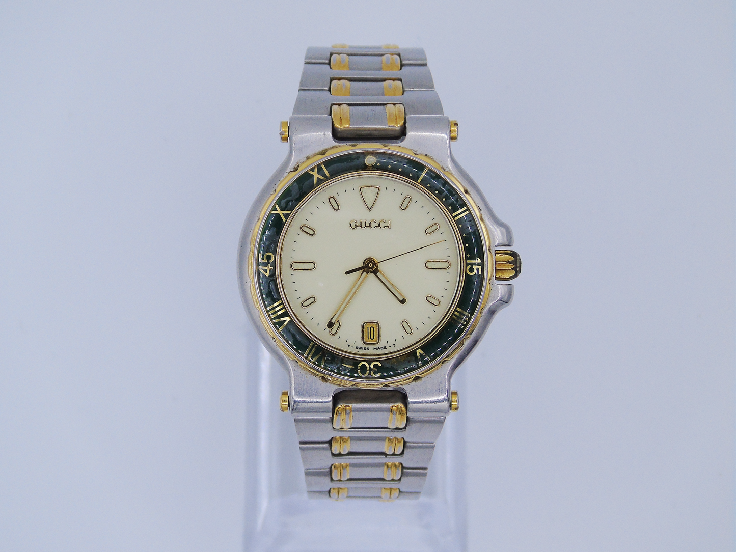Vintage Gucci Mens Watch Green Bezel Lumi Hour Markers Date Function Gold and Silver Tone Two Tone Quartz 9700 M - Gems Forgotten 