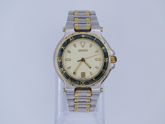 Vintage Gucci Mens Watch Green Bezel Lumi Hour Markers Date Function Gold and Silver Tone Two Tone Quartz 9700 M - Gems Forgotten 
