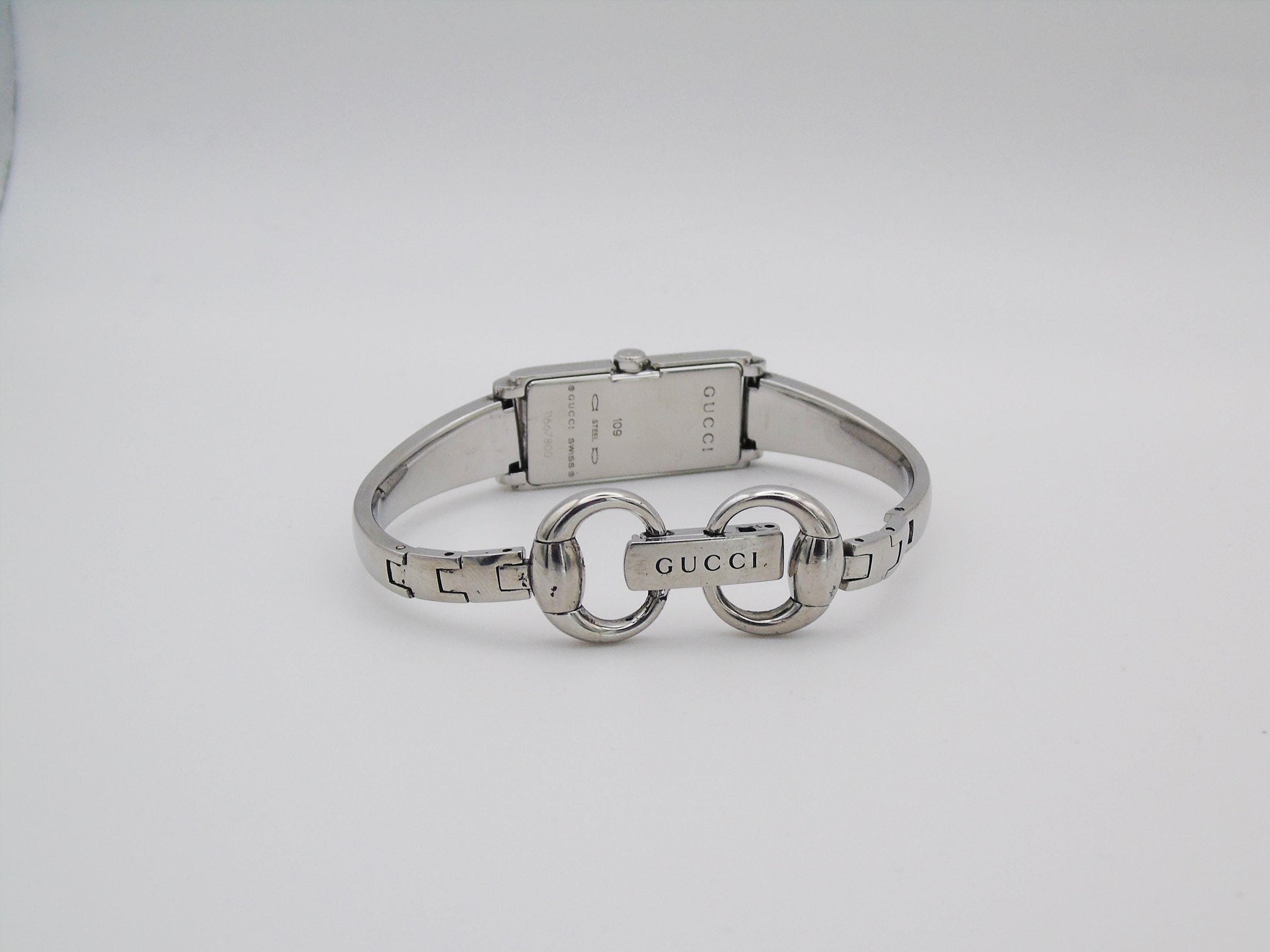 Vintage Gucci Watch: 1500L Black Dial, Stainless Steel Tank Style - Gems Forgotten 