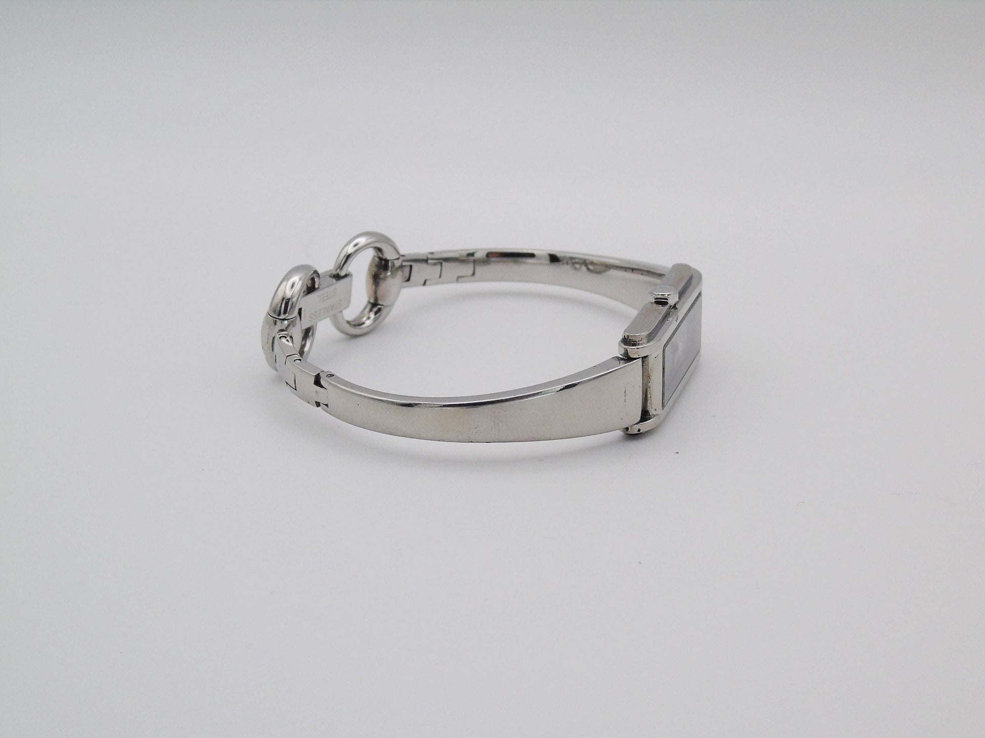Vintage Gucci Watch: 1500L Black Dial, Stainless Steel Tank Style - Gems Forgotten 