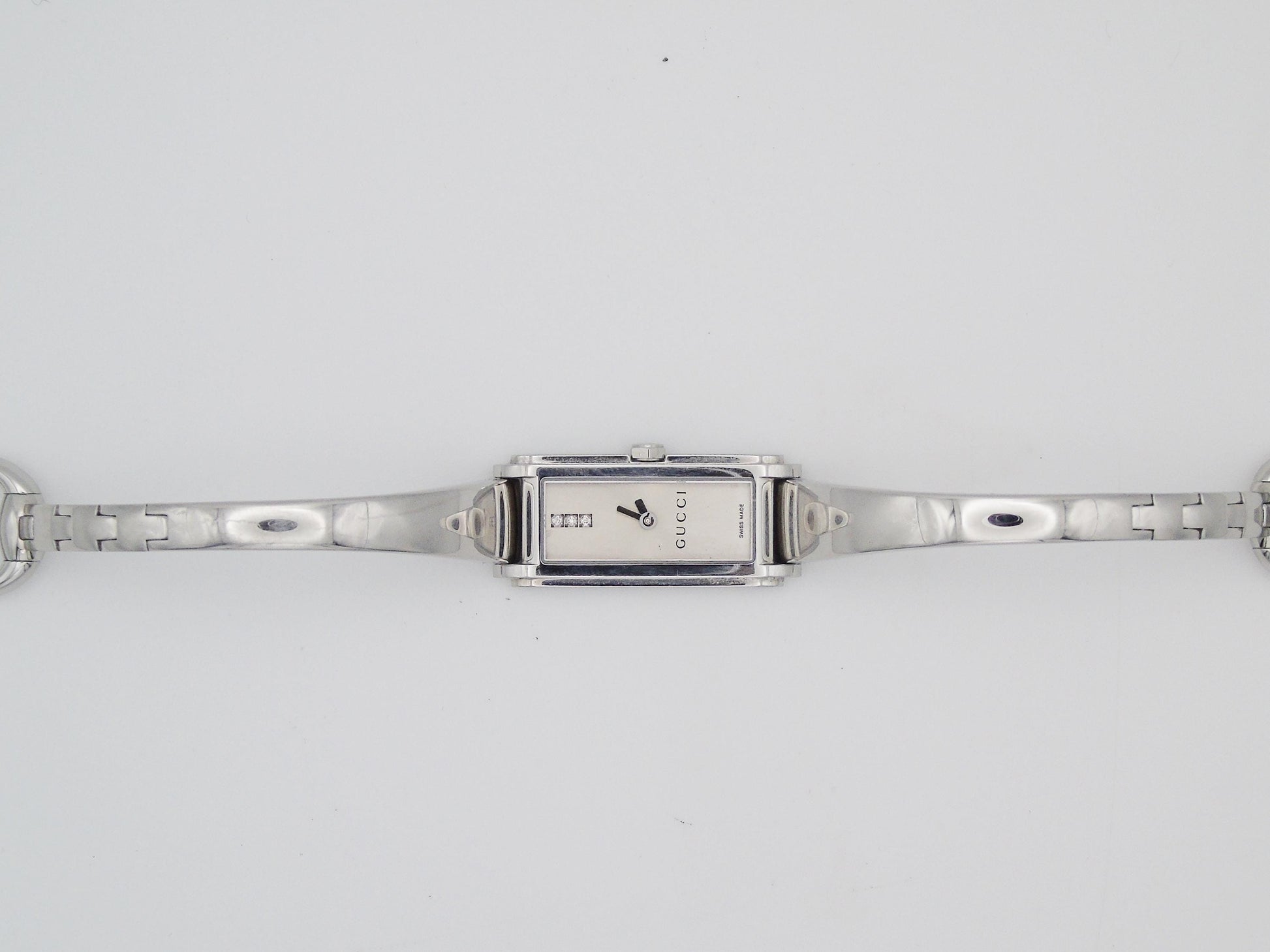 Gucci Ladies Silver Tone  Watch – Stunning Gucci 1500L Model with Tank Watch Diamond Steel - Gems Forgotten 