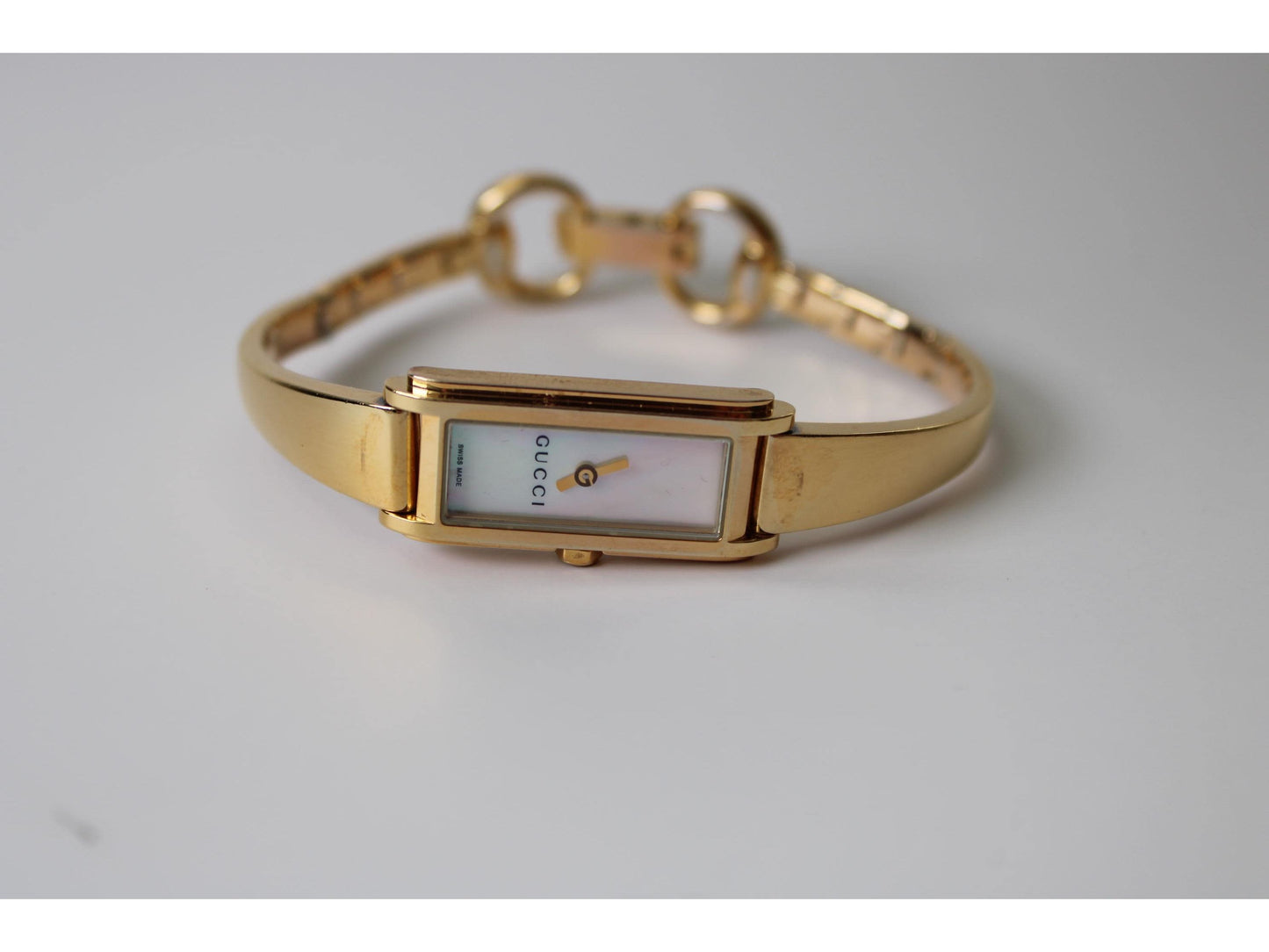 Gucci Ladies Gold Watch 1500L – Mother of Pearl Dial, Tank Face - Gems Forgotten 