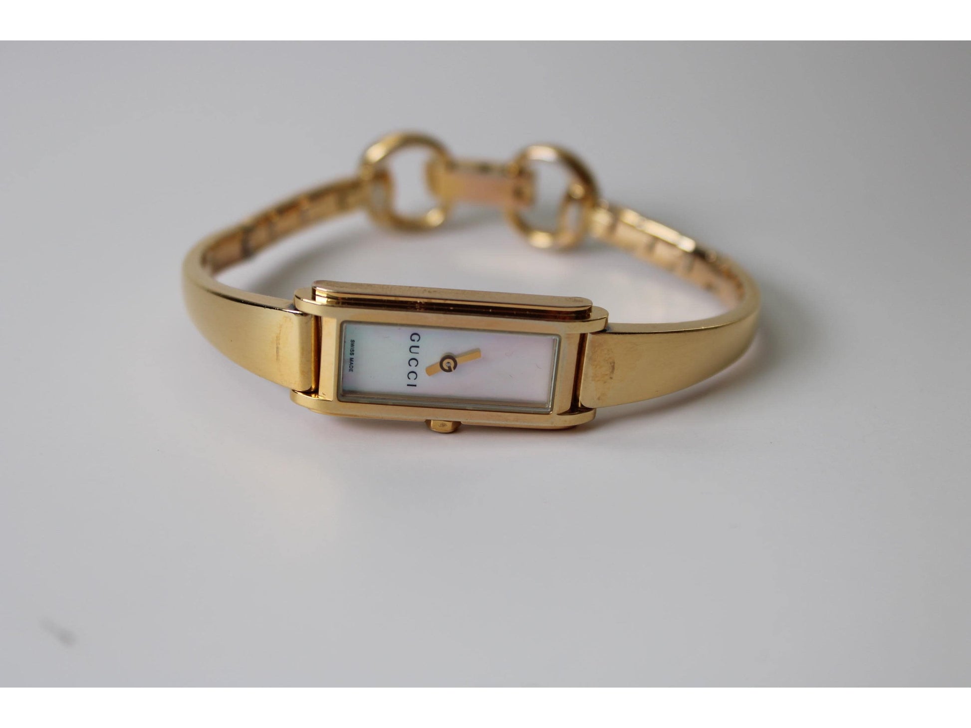 Gucci Ladies Gold Watch 1500L – Mother of Pearl Dial, Tank Face - Gems Forgotten 