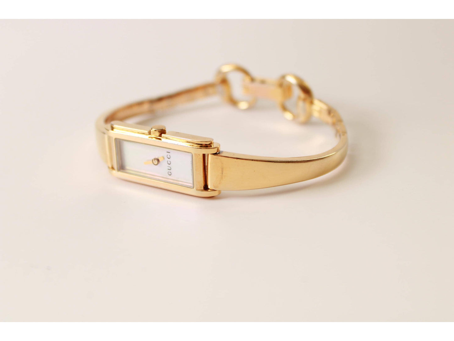 Gucci Ladies Gold Watch 1500L – Mother of Pearl Dial, Tank Face - Gems Forgotten 