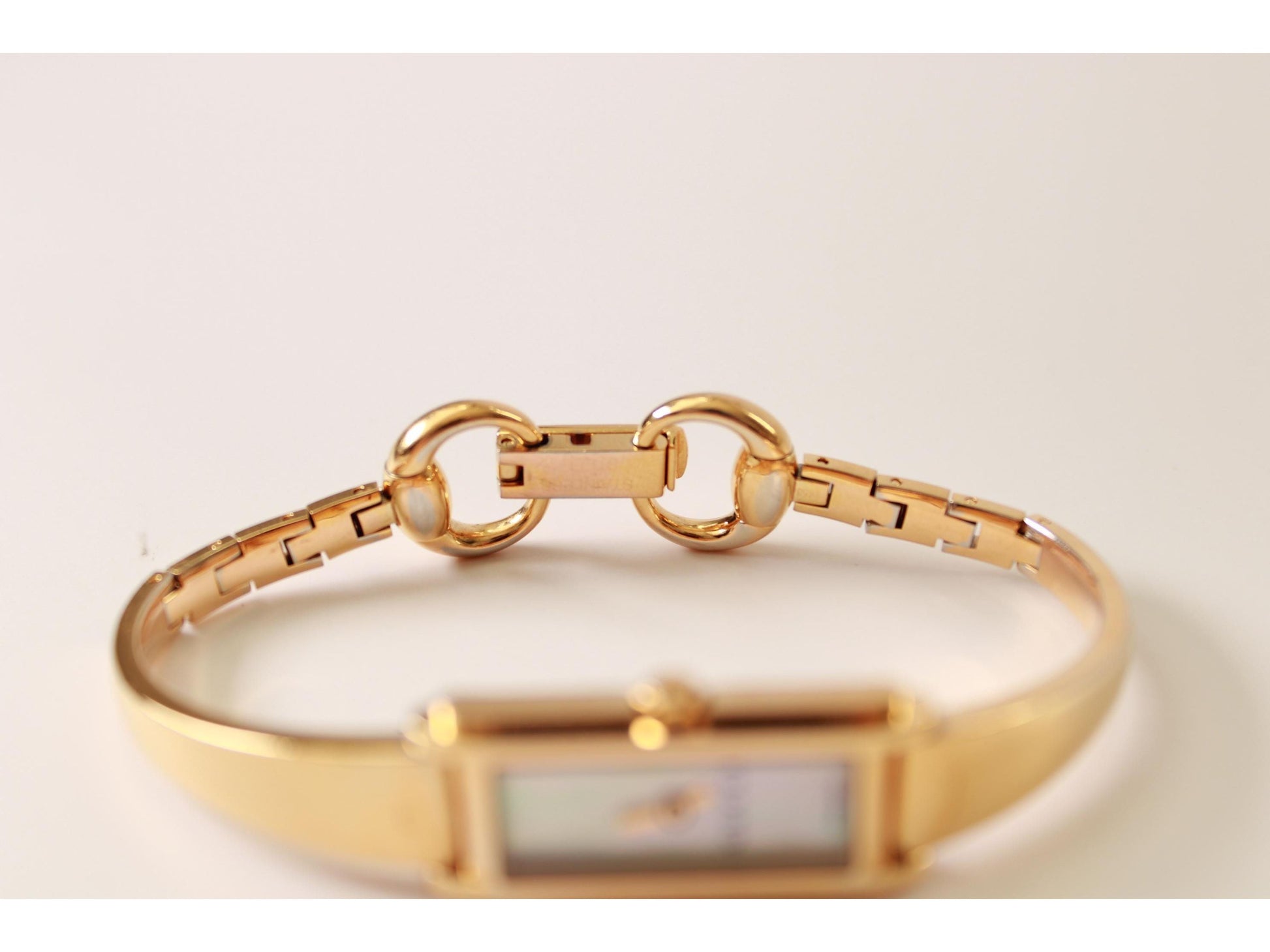 Gucci Ladies Gold Watch 1500L – Mother of Pearl Dial, Tank Face - Gems Forgotten 