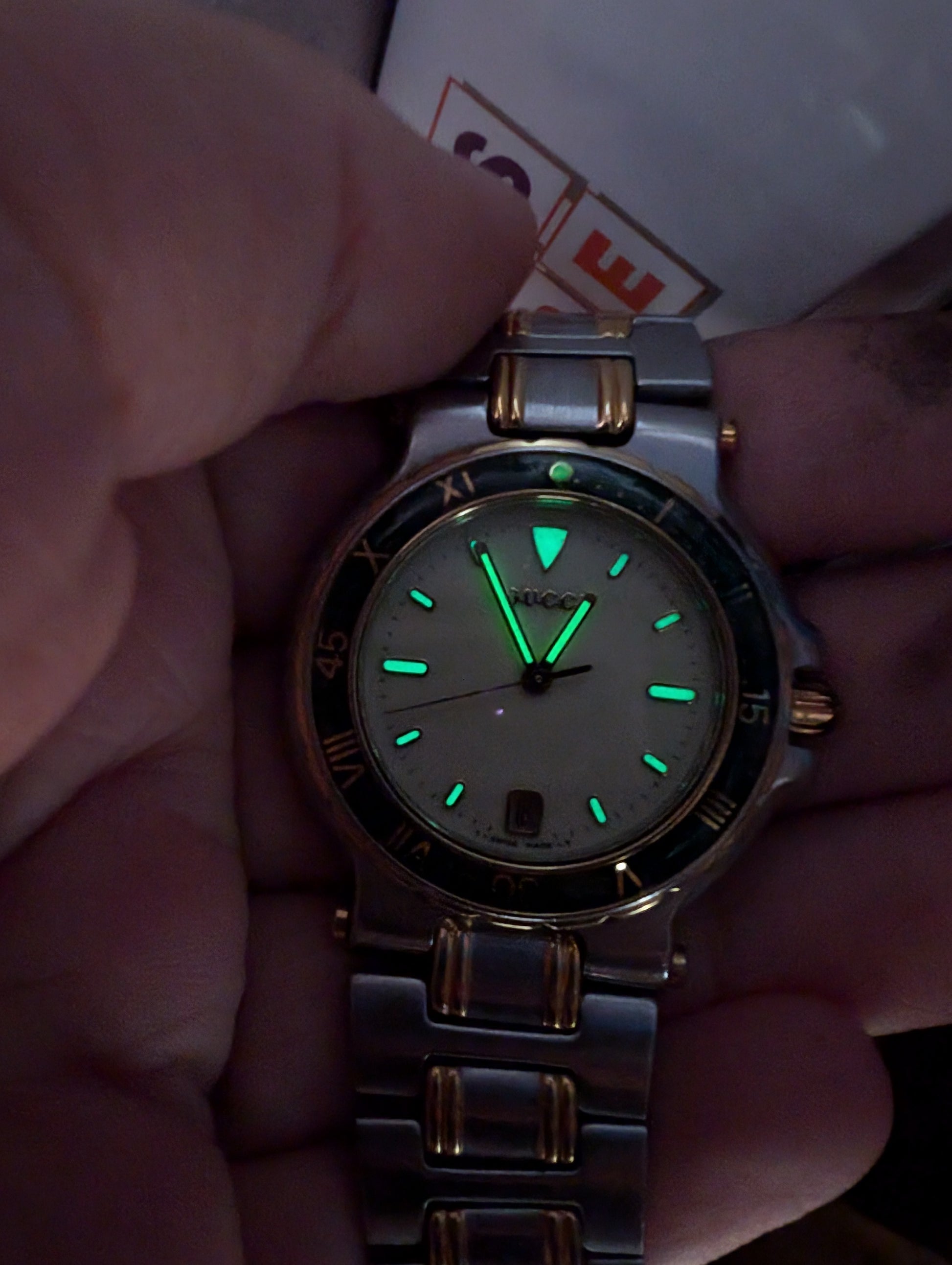 Vintage Gucci Mens Watch Green Bezel Lumi Hour Markers Date Function Gold and Silver Tone Two Tone Quartz 9700 M - Gems Forgotten 